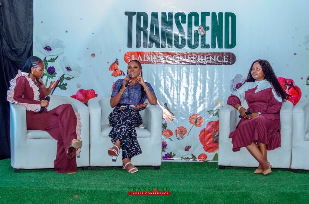 Speakers seated on stage during a panel session at the Transcend Ladies Conference